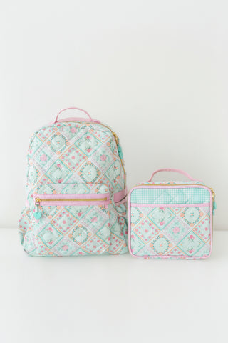 Matching quilted backpack and lunchbox in aqua floral patchwork print