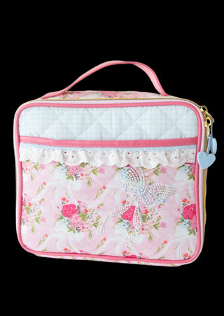 Floral patterned lunch bag with pink trim on a white background