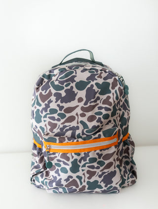 Backpack with camouflage pattern and orange zipper on a white background
